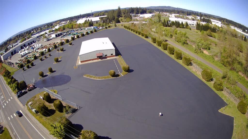 Birds eye view of commercial asphalt parking lot